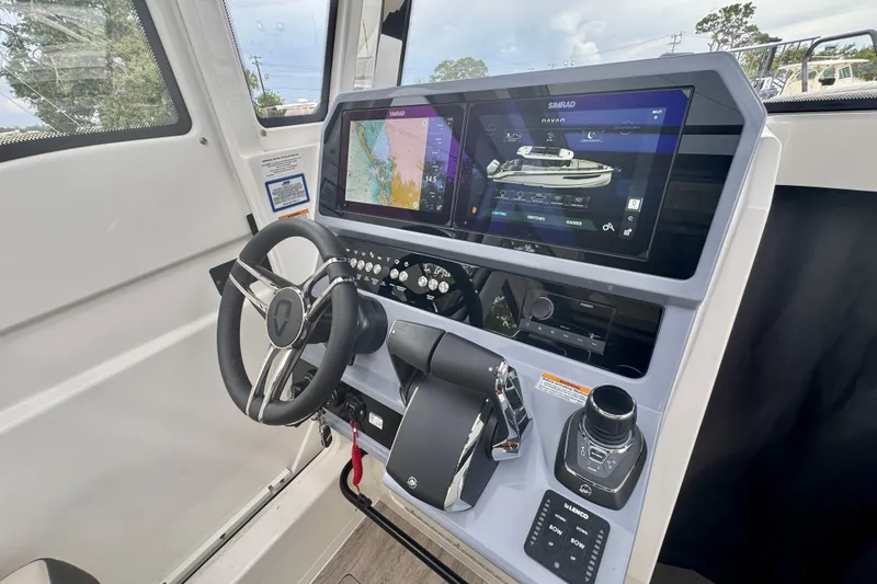 Slide: The Image of Interior view of 2026 Navan C30 boat cockpit with advanced navigation system and controls. - 30
