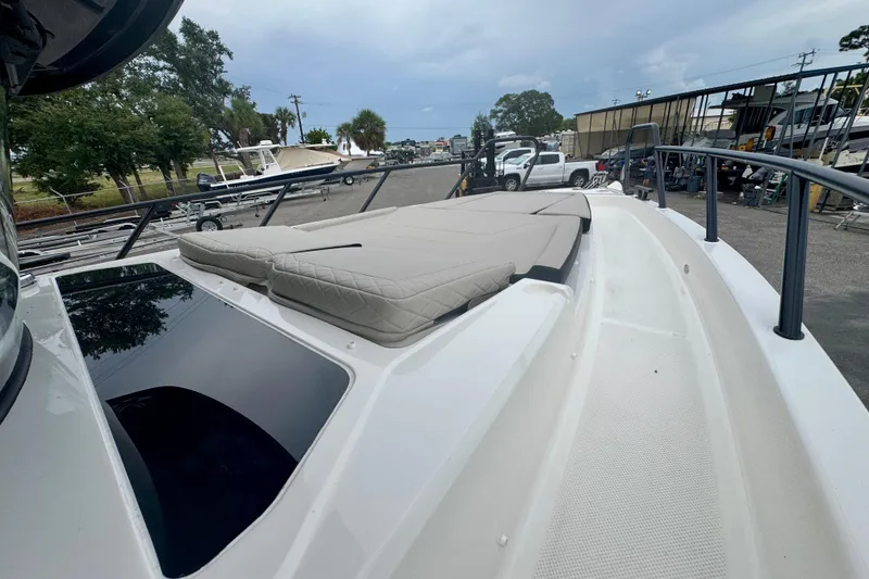 Slide: The Image of 2026 Navan C30 boat with cushioned deck, parked in a marina setting. - 47