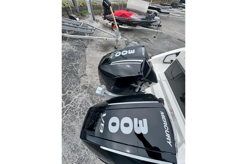 Slide: The Image of Twin Mercury 400 outboard engines on a Navan C30 boat, 2026 model, parked on a trailer. - 6