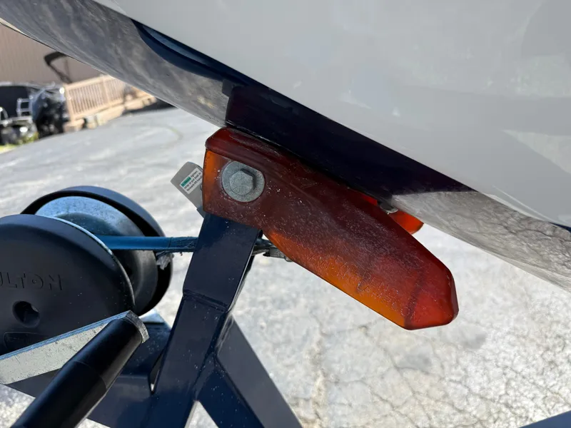 Slide: The Image of Close-up of a boat trailer with an orange protective pad. - 16