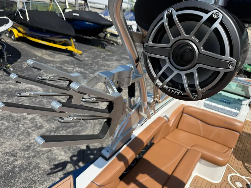 Slide: The Image of The image shows part of a 2016 MasterCraft X30 boat with speakers and racks. - 28