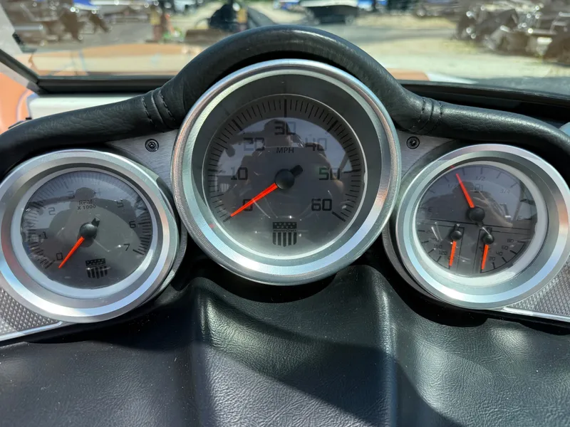 Slide: The Image of Dashboard of a 2016 MasterCraft X30 with speedometer and tachometer. - 47