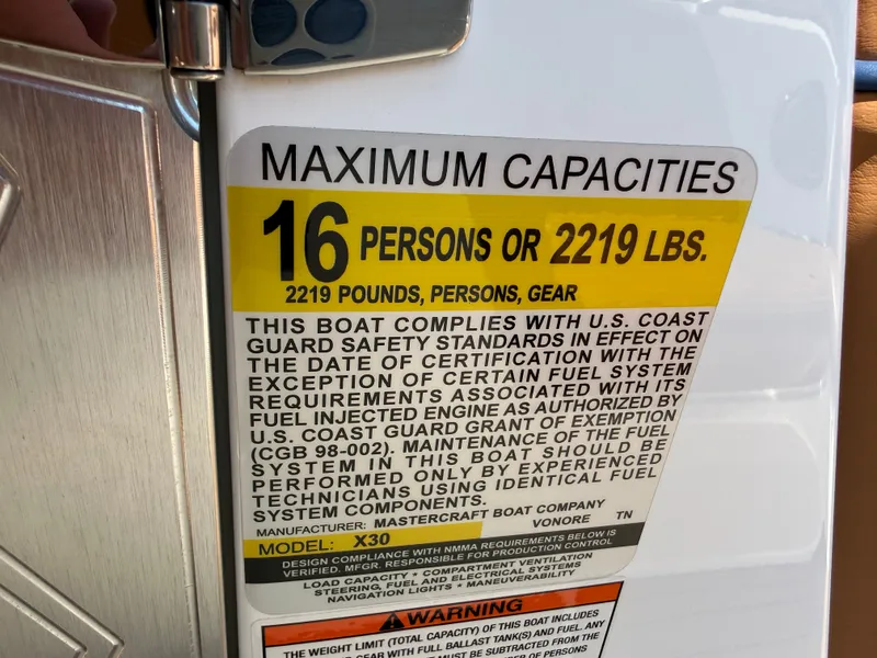 Slide: The Image of Sign shows maximum capacity of 16 persons or 2219 pounds for MasterCraft X30. - 36