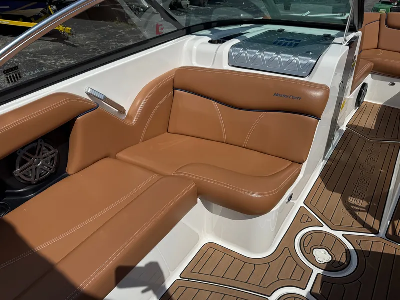 Slide: The Image of 2016 MasterCraft X30 with brown leather seating and sleek interior details. - 31