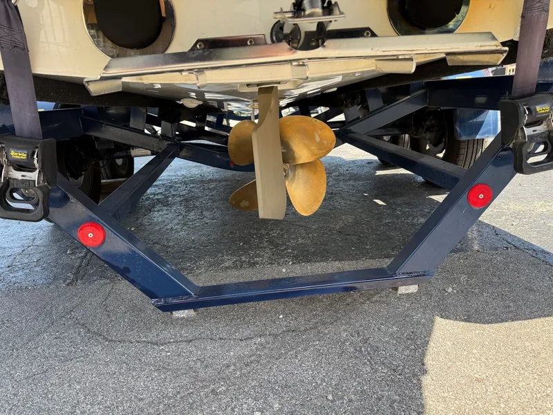 Slide: The Image of Rear view of a 2016 MasterCraft X30 with visible propeller and trailer. - 19