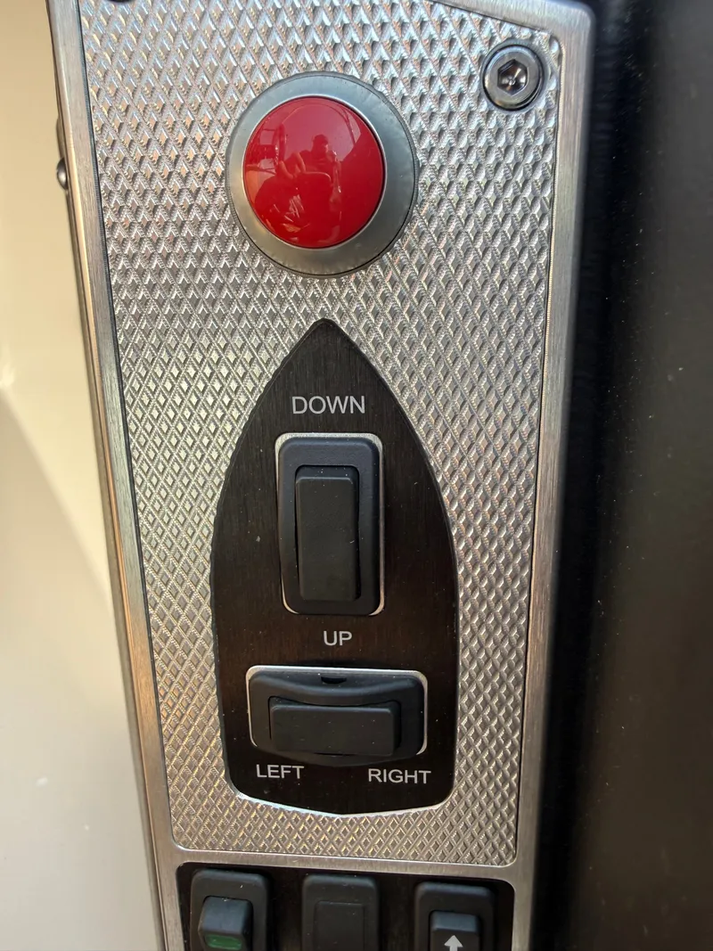 Slide: The Image of Close-up of a control panel with a large red button and directional switches. - 43