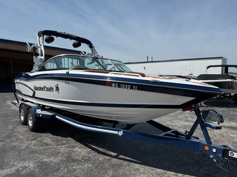 Slide: The Image of A 2016 MasterCraft X30 boat on a trailer, ready for use. - 8
