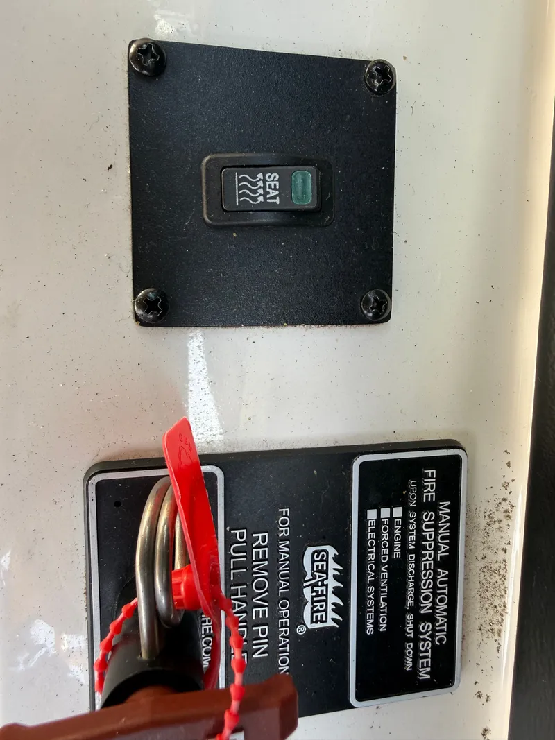 Slide: The Image of Close-up of a switch and fire suppression system on a boat. - 44
