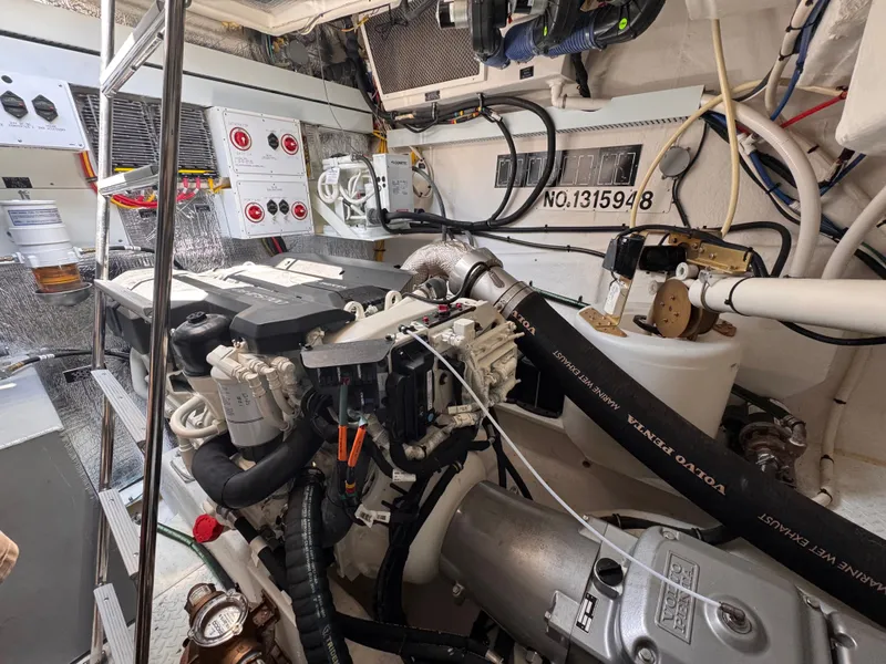 Slide: The Image of Engine room of the 2021 Cruisers Yachts 50 Cantius with Volvo Penta engine. - 40