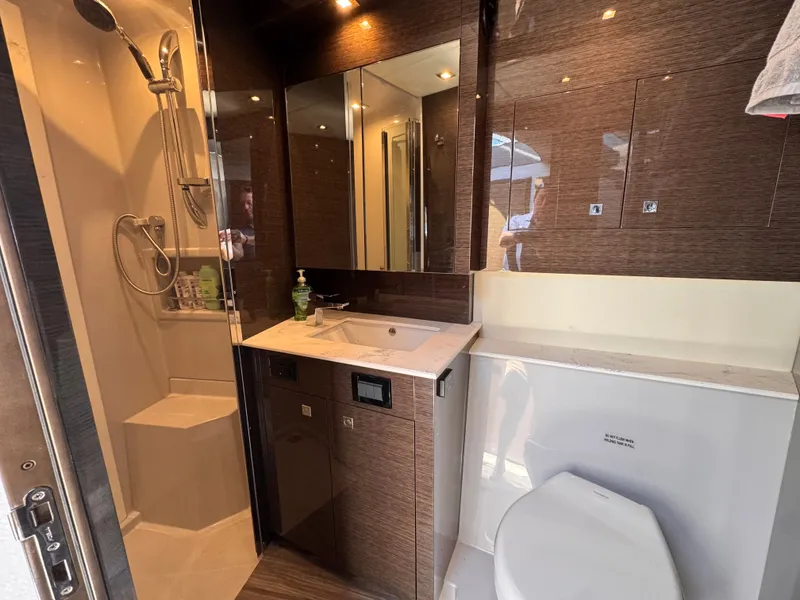 Slide: The Image of Luxurious bathroom with shower, sink, and toilet in a yacht. - 36