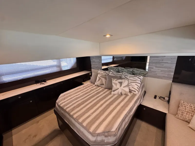 Slide: The Image of Interior of the 2021 Cruisers Yachts 50 Cantius featuring a cozy bed and modern accents. - 22