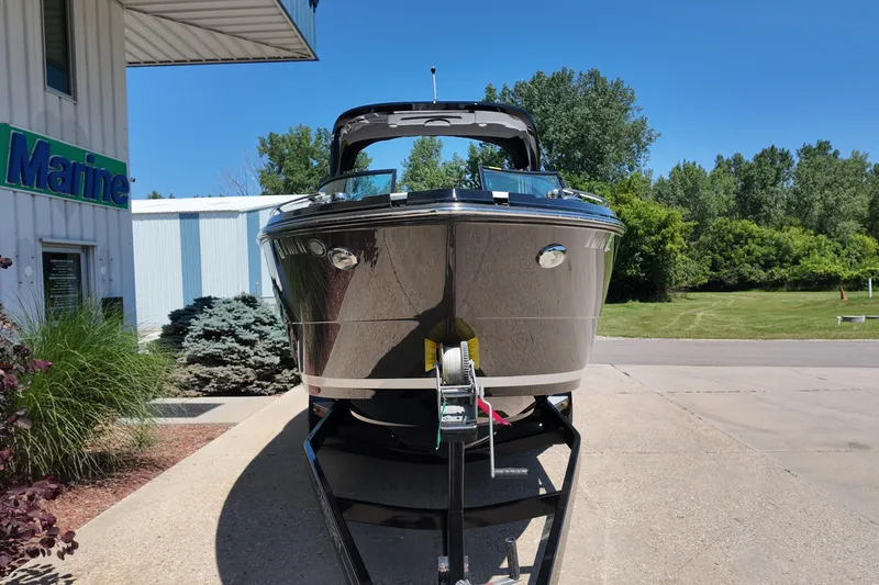 Slide: The Image of 2017 Monterey 258SS Super Sport boat on trailer, parked outside a marine dealership. - 34