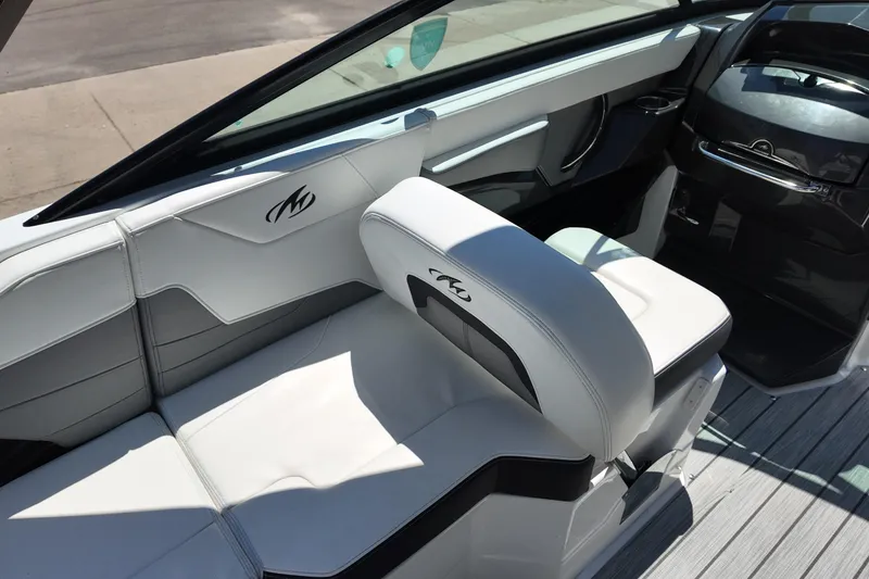 Slide: The Image of Interior of a 2017 Monterey 258SS Super Sport boat with white seating and sleek design. - 19