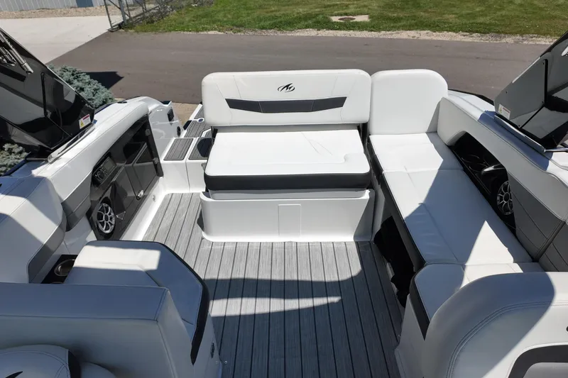 Slide: The Image of Interior view of a 2017 Monterey 258SS Super Sport boat with white seating and sleek design. - 28