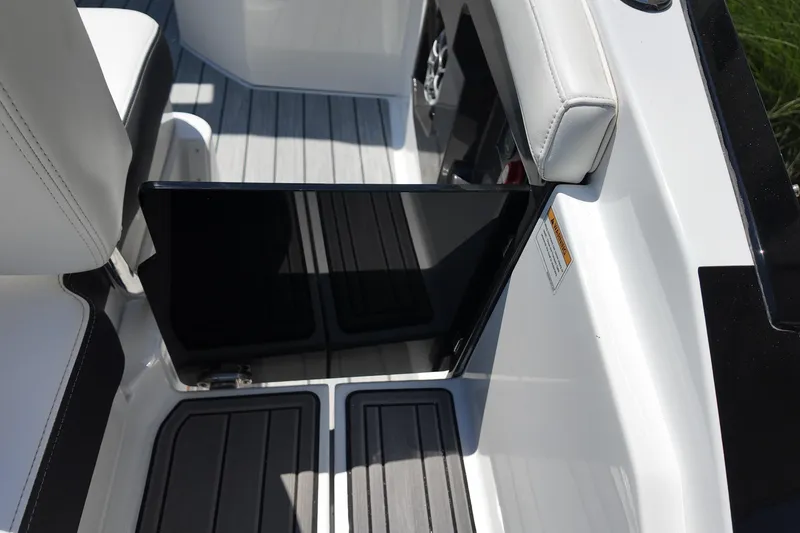 Slide: The Image of Interior view of a 2017 Monterey 258SS Super Sport boat with sleek seating and flooring. - 12