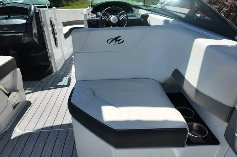 Slide: The Image of 2017 Monterey 258SS Super Sport boat interior with white seating and cup holders. - 33