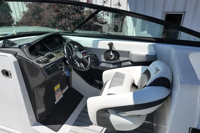 Slide: The Image of 2017 Monterey 258SS Super Sport boat interior with steering wheel and control panel. - 24