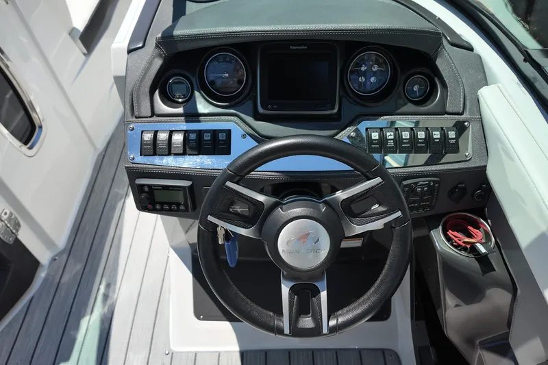 Slide: The Image of Steering console of 2017 Monterey 258SS Super Sport boat with controls and gauges. - 26