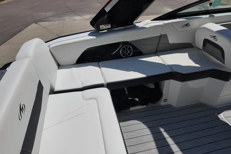 Slide: The Image of 2017 Monterey 258SS Super Sport boat interior with white seating and speaker system. - 15