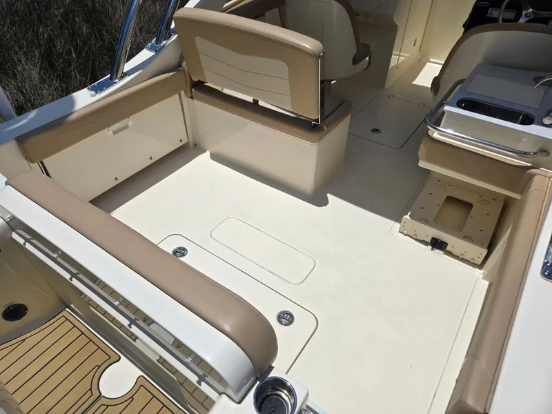 Slide: The Image of Interior of a Scout 240 Dorado boat with beige seating and flooring. - 3