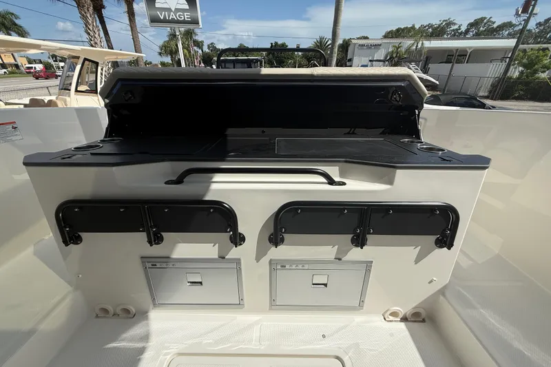 Slide: The Image of 2026 Navan S30 boat interior with storage compartments and sleek design. - 14
