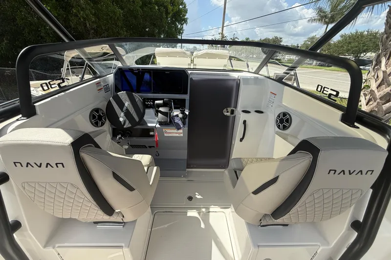 Slide: The Image of Interior of 2026 Navan S30 boat with modern dashboard and seating. - 10