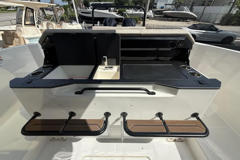 Slide: The Image of 2026 Navan S30 boat interior with seating, cup holders, and storage compartments. - 13