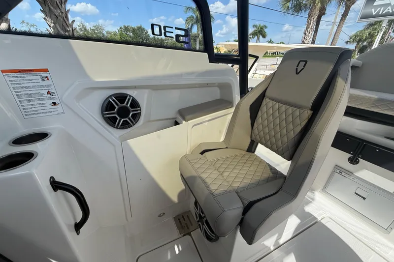 Slide: The Image of Interior of 2026 Navan S30 boat featuring a luxurious quilted seat and speaker. - 12