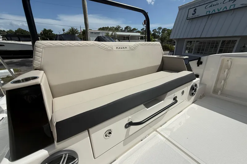 Slide: The Image of 2026 Navan S30 boat seating area with cup holder and speaker, showcasing luxury design. - 16