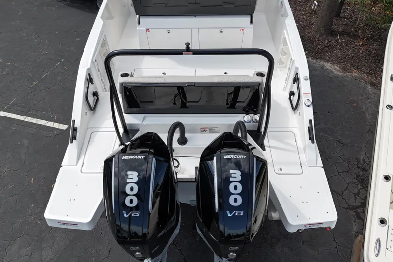 Slide: The Image of 2026 Navan S30 boat with dual Mercury 300 V8 engines, rear view. - 3