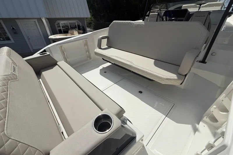Slide: The Image of Interior of 2026 Navan S30 boat with beige seating and cup holder. - 15