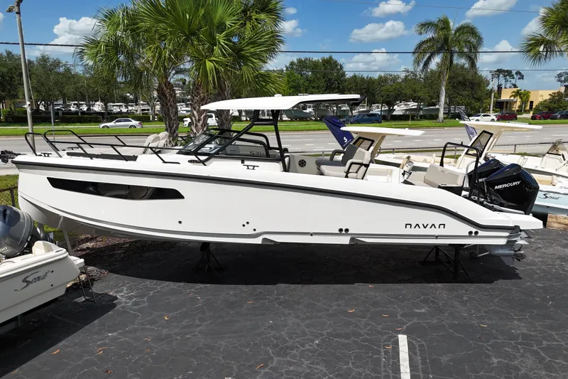 The Image of 2026 Navan S30 boat displayed outdoors with palm trees and clear sky. - 0