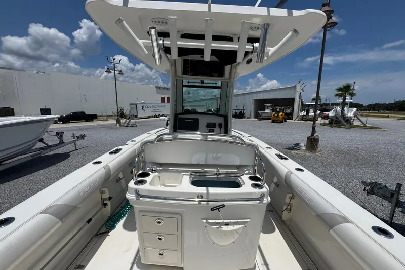 Slide: The Image of 2014 Boston Whaler 250 Outrage boat interior with fishing station and storage compartments. - 34