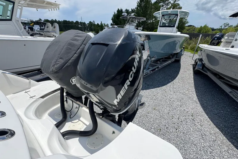 Slide: The Image of 2014 Boston Whaler 250 Outrage with Mercury outboard engines on a gravel lot. - 38