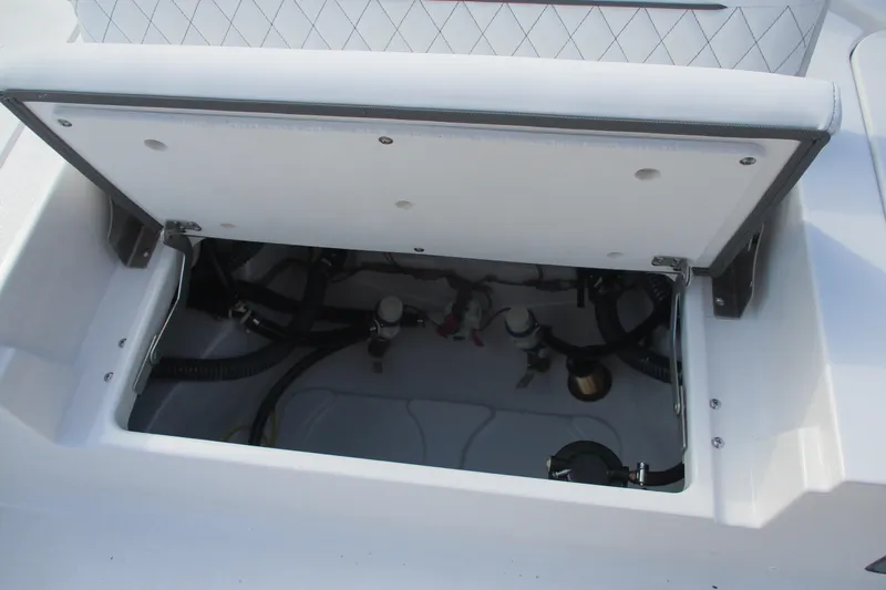 Slide: The Image of Open storage compartment on 2026 Sportsman Masters 247OE Bay Boat, showcasing internal components. - 13