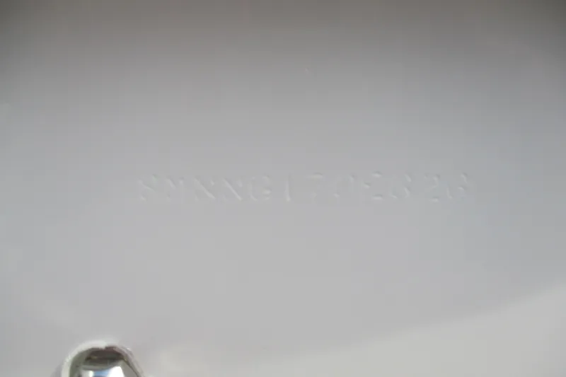 Slide: The Image of 2026 Sportsman Masters 247OE Bay Boat hull detail with embossed text. - 19