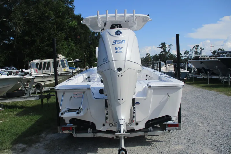 Slide: The Image of 2026 Sportsman Masters 247OE Bay Boat with powerful 350 V6 engine, parked outdoors. - 4