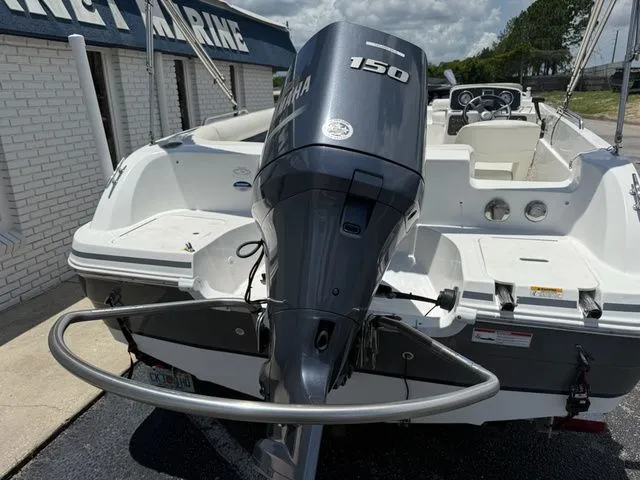 Slide: The Image of A 2014 Hurricane 201 Sun Deck Sport with a Yamaha 150 outboard motor. - 5