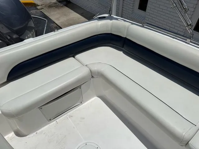 Slide: The Image of The image shows the seating area of a 2014 Hurricane 201 Sun Deck Sport boat. - 11