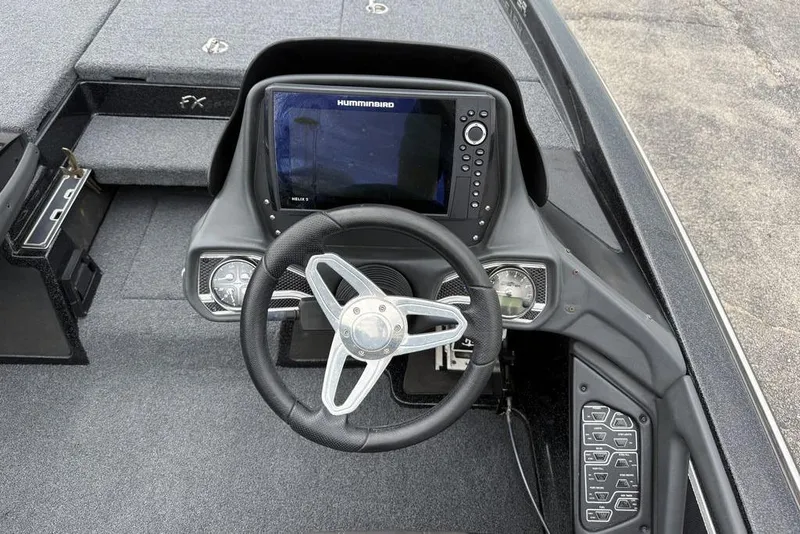 Slide: The Image of Steering console of 2014 Skeeter FX210 boat with Humminbird Helix 5 display. - 11
