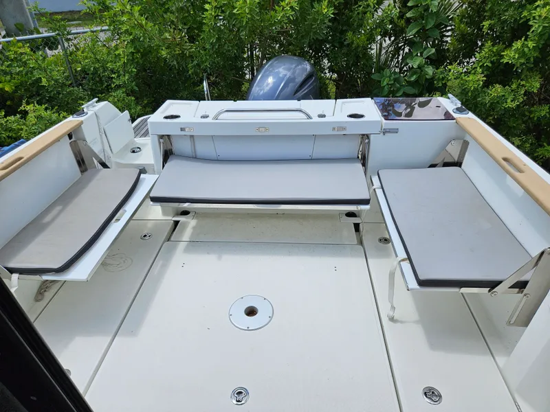 Slide: The Image of The image shows the cockpit of a 2020 Jeanneau NC 795 with seating benches. - 3
