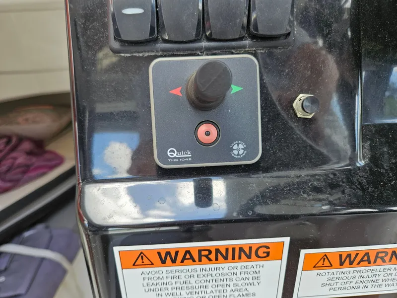 Slide: The Image of Close-up of a control panel with warning labels and a button. - 7