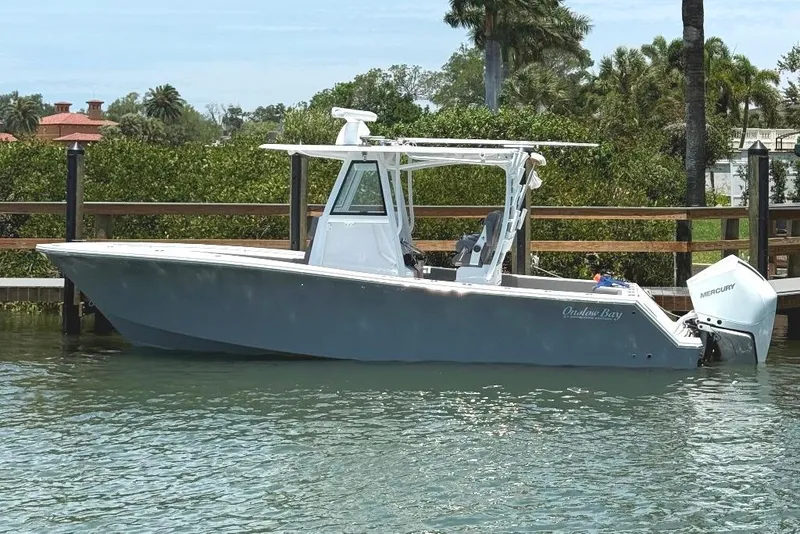 The Image of 2023 Onslow Bay 27 Offshore Edition boat docked on calm water. - 0