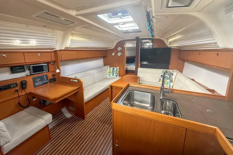 Slide: The Image of Interior of 2014 Bavaria Cruiser 37 yacht with modern kitchen and seating area. - 5