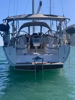 Slide: The Image of A 2014 Bavaria Cruiser 37 on calm water. View of the cockpit and steering wheels. - 44