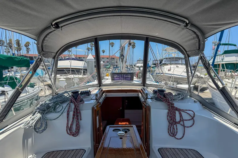 Slide: The Image of Cockpit view of a 2014 Bavaria Cruiser 37 sailboat docked at a marina. - 32