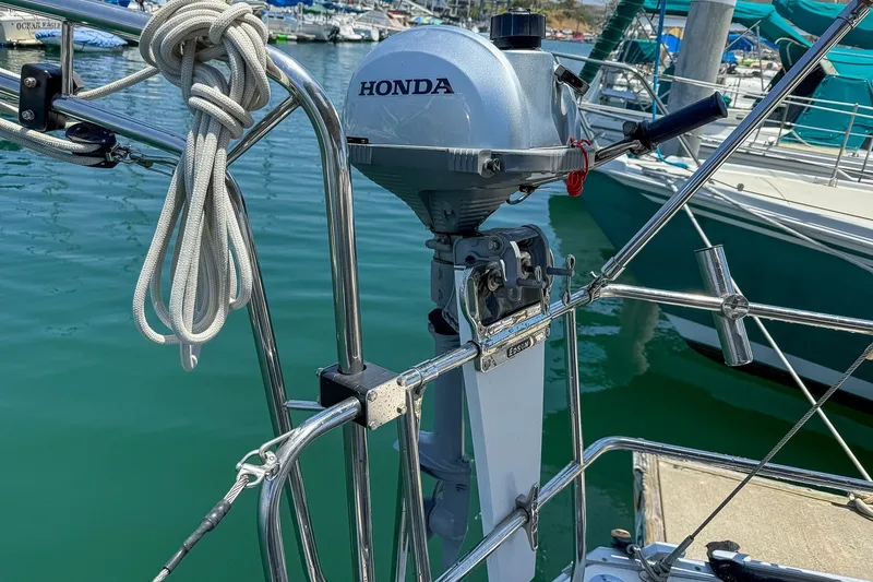 Slide: The Image of Honda outboard motor on Bavaria Cruiser 37 sailboat, docked in marina, 2014 model. - 43