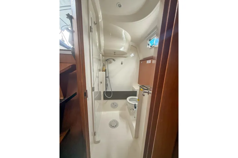 Slide: The Image of Bathroom interior of 2014 Bavaria Cruiser 37 yacht, featuring shower and toilet. - 17