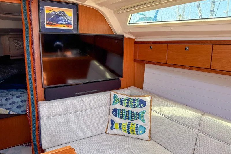 Slide: The Image of Interior of 2014 Bavaria Cruiser 37 yacht with TV and decorative fish pillow. - 12