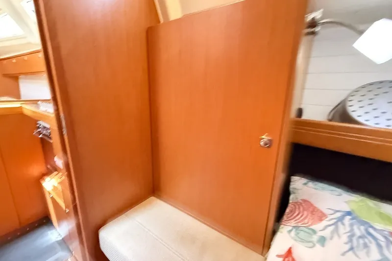 Slide: The Image of Interior of 2014 Bavaria Cruiser 37 yacht with wooden cabinetry and cozy seating area. - 20
